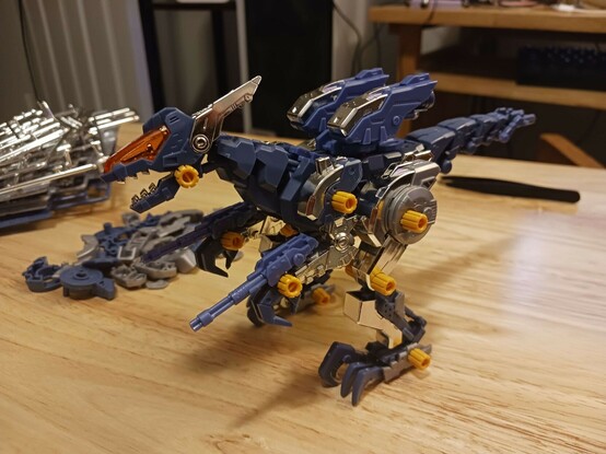 A photograph of Abigail reassembled with her full suite of silver teeth, toes, missile hatches, and limb armour. The picture does a surprisingly good job of conveying just how shiny this stuff is.

As a very nice side-benefit, the missile hatch lids were actually a little loose in some cases, but the chrome plating is a coat that goes on over the plastic, so they're actually tighter than they were and should be easier to keep open now, when desired.