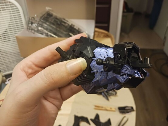 A photograph of Stheno's torso assembly. There's some neat ribby sort of scale plates towards the front which have been carefully coloured in, as well as other details here and there. The core assembly can be seen at the front, just under where the neck and head will slot on, probably when she's a bit more done.