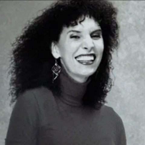A B&W picture of Danielle Bunten-Berry, a trans woman, game developer, and total badass.